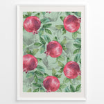 Indlæs billede til gallerivisning Watercolor botanical poster featuring red pomegranates with green leaves on a mint green background, framed in white.
