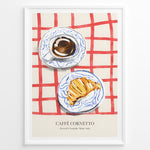 Indlæs billede til gallerivisning Italian breakfast poster with espresso and croissant on blue-patterned plates over a red checkered tablecloth, titled “Caffè Cornetto.”
