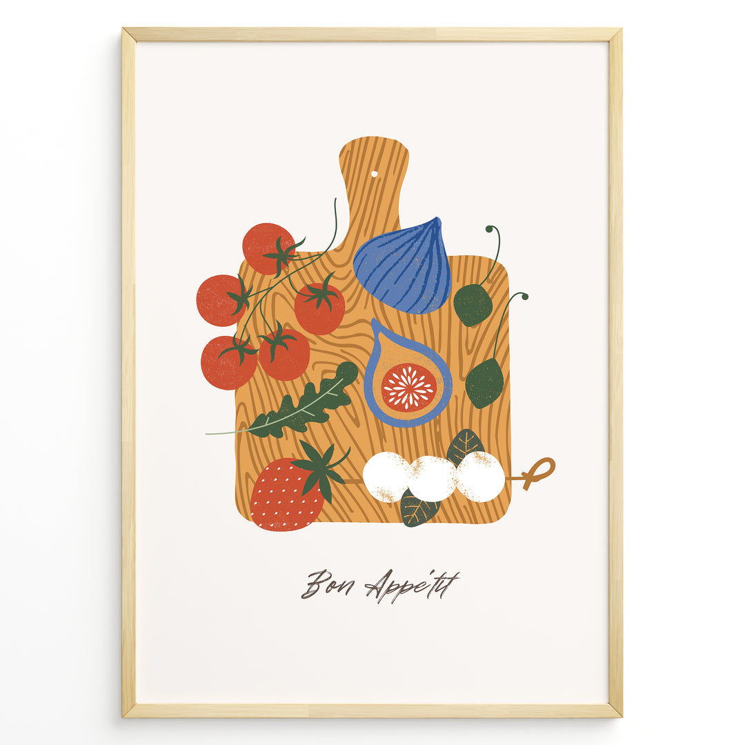 Bon Appétit art print plakat with tomatoes, figs, strawberries, and cheese on a wooden cutting board illustration in a golden frame.
