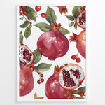 Indlæs billede til gallerivisning Vibrant pomegranate poster with red pomegranates, open fruits showing seeds, and green leaves on a white background, framed in black for modern kitchen or dining wall décor.
