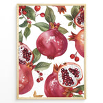 Indlæs billede til gallerivisning Vibrant pomegranate poster with red pomegranates, open fruits showing seeds, and green leaves on a white background, framed in black for modern kitchen or dining wall décor.
