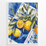 Indlæs billede til gallerivisning Mediterranean lemon wall art with yellow lemons and olive leaves on blue and white tile background, framed in black, ideal for kitchen or dining room décor.
