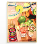 Indlæs billede til gallerivisning Colorful margarita cocktail poster with lime slices, tequila shots, and vibrant bar accessories on a wooden counter, ideal for kitchen or home bar wall décor.
