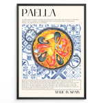 Indlæs billede til gallerivisning Watercolor paella wall art showing seafood, rice, and mussels on blue patterned tiles, framed in black, ideal for Spanish kitchen or restaurant wall decoration.
