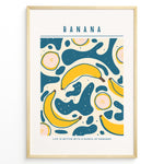 Indlæs billede til gallerivisning Colorful banana art print plakat with abstract teal and yellow shapes, text reading “Life is better with a bunch of bananas,” framed in golden.

