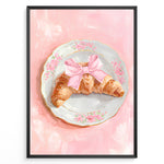 Indlæs billede til gallerivisning Illustrated croissant with a pink bow on a floral plate over a pink background.
