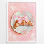 Indlæs billede til gallerivisning Illustrated croissant with a pink bow on a floral plate over a pink background.
