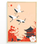 Indlæs billede til gallerivisning Japanese-style poster with three flying cranes, red floral elements, and a traditional temple against a soft peach background, framed in black.
