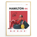 Indlæs billede til gallerivisning Framed Hamilton 44 Scuderia Ferrari F1 poster showing the driver in a red suit leaning on tires, holding a yellow helmet, with signature and career stats.
