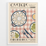Indlæs billede til gallerivisning Vintage French oysters poster with illustrated oyster platter, lemon slices, and cutlery on a pink checkered background in a white frame.
