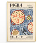 Indlæs billede til gallerivisning Vintage Spanish paella poster with illustrated pan of rice, prawns, and lemon slices on a blue patterned background in a gold frame.
