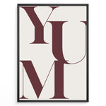 Indlæs billede til gallerivisning Minimalist typography wall art print plakat with the word “YUM” in large maroon letters on a cream background framed in black.
