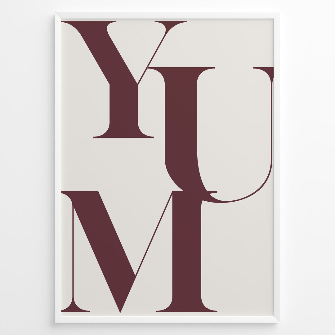 Minimalist typography wall art print plakat with the word “YUM” in large maroon letters on a cream background framed in black.