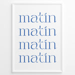 Indlæs billede til gallerivisning Minimalist French typography poster with the word “matin” repeated four times in blue text on a white background in a white frame.
