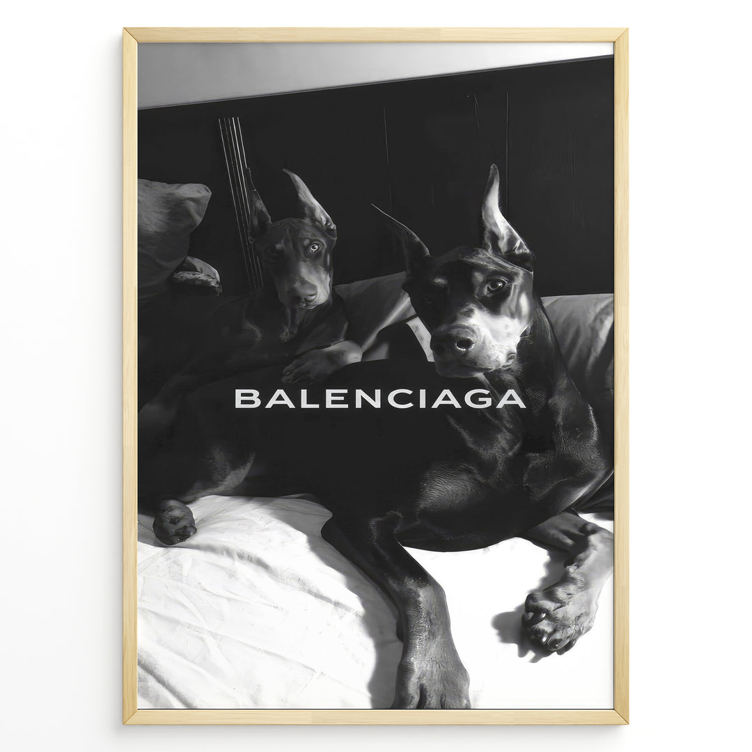 Fashion Plakat | Balenciaga Poster Featuring Dobermans in Black and White Plakaty.dk | Black and white poster of two Dobermans lying on a bed with the Balenciaga logo across the center.