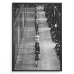 Indlæs billede til gallerivisning Fashion Plakat | Black &amp; White Fashion Runway – Editorial Wall Art Print Plakaty.dk | Black and white photograph of runway models walking in a single-file line during a fashion show, with seated spectators on one side of the runway.

