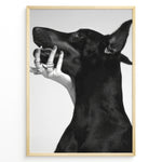 Indlæs billede til gallerivisning Fashion Plakat | Black and White Fashion Art Print – Dog with Hand Adorned in Rings Plakaty.dk | Black and white artistic photo of a black dog with a human hand wearing multiple rings gently placed on its jaw.
