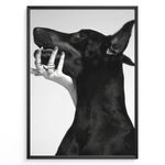 Indlæs billede til gallerivisning Fashion Plakat | Black and White Fashion Art Print – Dog with Hand Adorned in Rings Plakaty.dk | Black and white artistic photo of a black dog with a human hand wearing multiple rings gently placed on its jaw.
