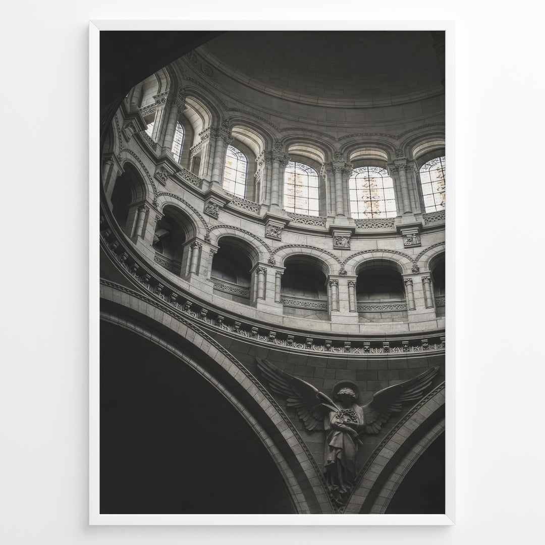 Fashion Plakat | Cathedral Dome with Angel Sculpture – Architectural Elegance Plakaty.dk | Interior view of a cathedral dome with arched windows and a stone angel sculpture beneath grand architectural arches.