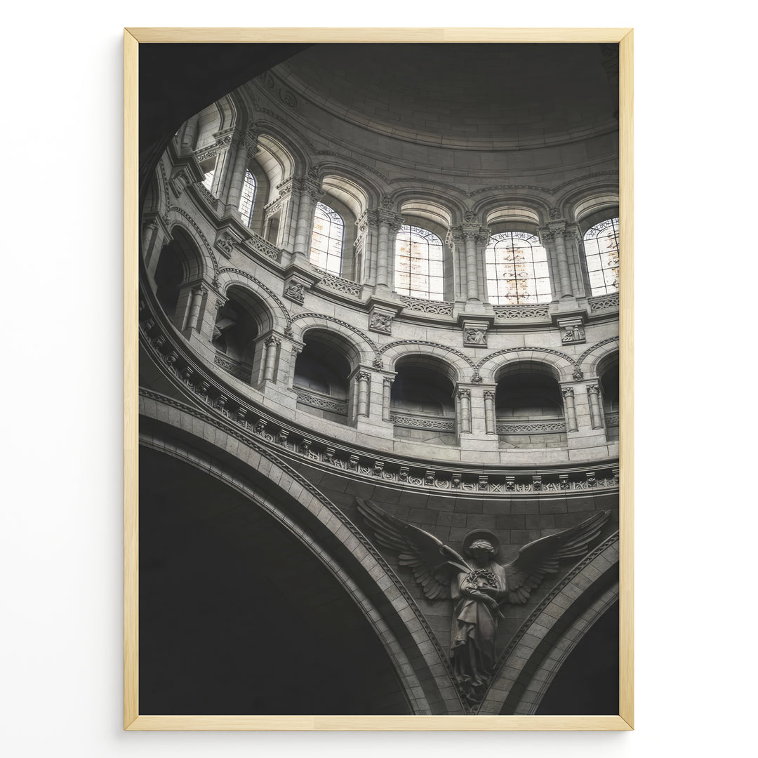 Fashion Plakat | Cathedral Dome with Angel Sculpture – Architectural Elegance Plakaty.dk | Interior view of a cathedral dome with arched windows and a stone angel sculpture beneath grand architectural arches.