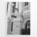 Indlæs billede til gallerivisning Fashion Plakat | Chanel Boutique Exterior – Monte Carlo, Monaco Plakaty.dk | Black and white photo of the Chanel storefront in Monte Carlo, Monaco, showcasing ornate architecture with columns, balconies, and a hanging sign.
