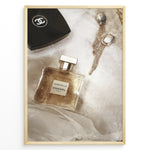 Indlæs billede til gallerivisning Fashion Plakat | Chanel Gabrielle Perfume Flat Lay with Earrings and Compact – Luxury Beauty Print Plakaty.dk | Flat lay image of Chanel Gabrielle perfume, a black Chanel compact, and gold statement earrings on soft white fabric.
