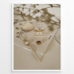 Indlæs billede til gallerivisning Fashion Plakat | Chanel No. 5 Perfume Flat Lay with Watch and Books – Neutral Aesthetic Print Plakaty.dk | Flat lay of Chanel No. 5 perfume bottle, gold watch, ring, and decorative shell on fashion books with soft floral blur in neutral tones.

