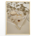Indlæs billede til gallerivisning Fashion Plakat | Chanel No. 5 Perfume Flat Lay with Watch and Books – Neutral Aesthetic Print Plakaty.dk | Flat lay of Chanel No. 5 perfume bottle, gold watch, ring, and decorative shell on fashion books with soft floral blur in neutral tones.
