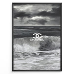 Indlæs billede til gallerivisning Fashion Plakat | Chanel Ocean Wave Black &amp; White Fashion Poster Plakaty.dk | Black and white ocean wave poster with the Chanel logo centered over crashing waves and a stormy sky.
