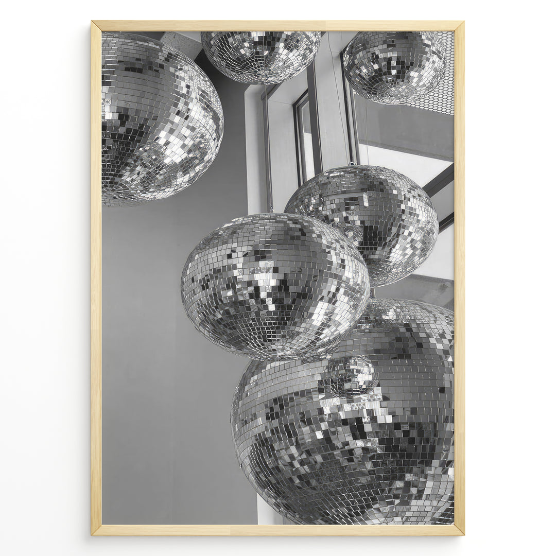 Fashion Plakat | Cluster of Disco Balls in Natural Light Plakaty.dk | Black and white photo of multiple hanging disco balls reflecting natural light near large windows
