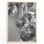 Indlæs billede til gallerivisning Fashion Plakat | Cluster of Disco Balls in Natural Light Plakaty.dk | Black and white photo of multiple hanging disco balls reflecting natural light near large windows
