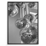 Indlæs billede til gallerivisning Fashion Plakat | Cluster of Disco Balls in Natural Light Plakaty.dk | Black and white photo of multiple hanging disco balls reflecting natural light near large windows
