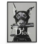 Indlæs billede til gallerivisning Fashion Plakat | Dior Guard Dog Poster – Bold Fashion Statement Wall Art Plakaty.dk | Black and white image of a Doberman dog holding a handgun in its mouth, wearing a Dior collar, with &quot;Dior&quot; text overlayed – a bold, edgy luxury fashion print.
