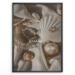 Indlæs billede til gallerivisning Fashion Plakat | Elegant Chanel-Inspired Flat Lay with Seashells and Jewelry Plakaty.dk | Flat lay of elegant seashells, a pearl bracelet, and gold jewelry on soft ivory fabric with the Chanel logo centered.
