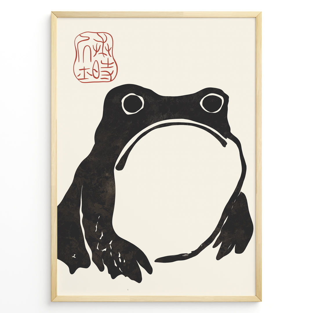 Japanese minimalist black frog art print plakat with red stamp detail in a modern black frame on cream background.