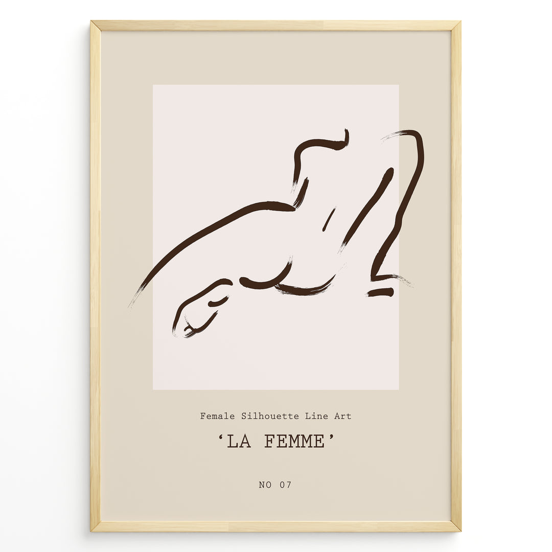 Framed “La Femme No.07” poster with minimalist brown line art of a reclining female silhouette on a beige and blush background.