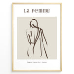 Indlæs billede til gallerivisning Framed “La Femme No.1” poster with minimalist brown line art of a woman’s back draped in fabric on a beige background.
