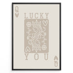Indlæs billede til gallerivisning Framed minimalist “Lucky You” poster featuring Queen of Hearts playing card design in beige tones on a neutral background.
