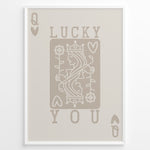 Indlæs billede til gallerivisning Framed minimalist “Lucky You” poster featuring Queen of Hearts playing card design in beige tones on a neutral background.
