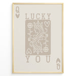 Indlæs billede til gallerivisning Framed minimalist “Lucky You” poster featuring Queen of Hearts playing card design in beige tones on a neutral background.
