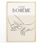 Indlæs billede til gallerivisning Framed Galerie Bohème poster featuring minimalist black line art of two hands holding each other on a beige and white background.
