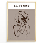 Indlæs billede til gallerivisning Framed “La Femme No.03” poster with minimalist brown line art of a woman holding a flower on a taupe background from the Bohemian Collection.
