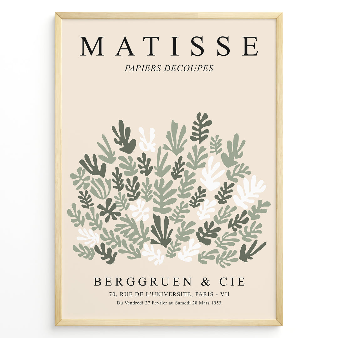 Framed Matisse-style botanical poster with abstract green and white leaf cutout shapes and beige background, titled “Papiers Découpés.”
