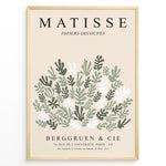 Indlæs billede til gallerivisning Framed Matisse-style botanical poster with abstract green and white leaf cutout shapes and beige background, titled “Papiers Découpés.”
