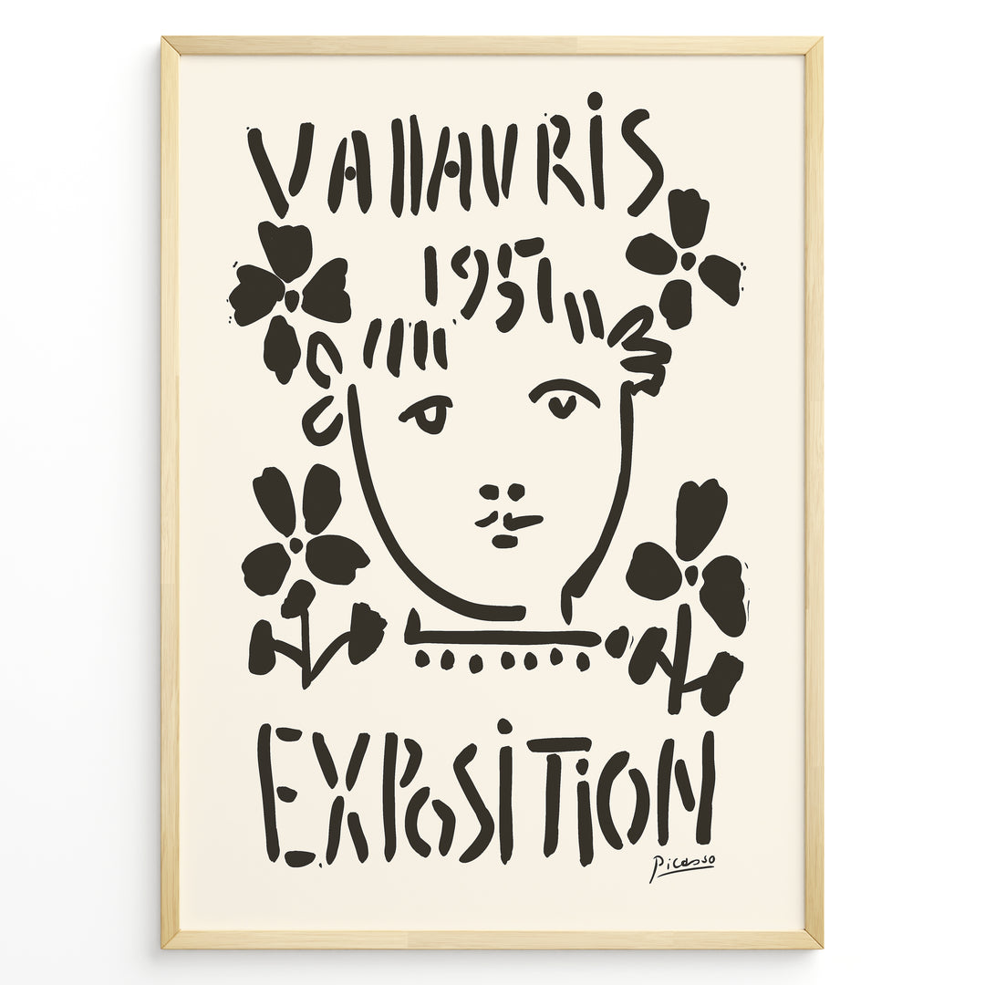 Framed Picasso Vallauris 1951 Exposition poster with black abstract portrait and floral designs on a cream background.