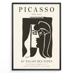 Indlæs billede til gallerivisning Framed Picasso “The Kiss” poster with two abstract faces in black on a beige background.

