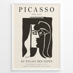 Indlæs billede til gallerivisning Framed Picasso “The Kiss” poster with two abstract faces in black on a beige background.
