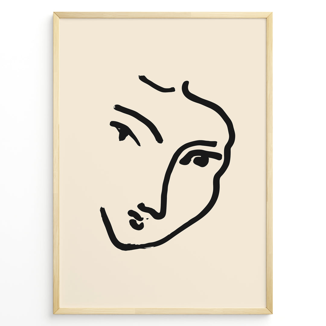 Minimal abstract face line art poster in black frame on beige background.