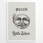 Indlæs billede til gallerivisning Framed Duke’s Little Joker vintage poster with detailed moon face illustration smoking a cigarette on a beige textured background.
