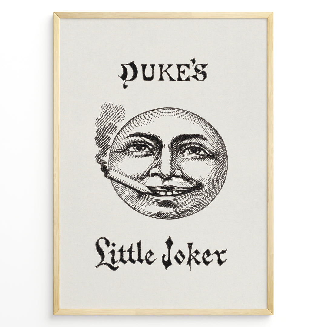 Framed Duke’s Little Joker vintage poster with detailed moon face illustration smoking a cigarette on a beige textured background.